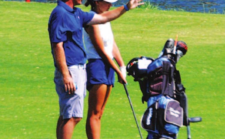 Head coach Justin Schulze talks about a shot with Shaylee Wolfe. HUNTER KING | DISPATCH RECORD