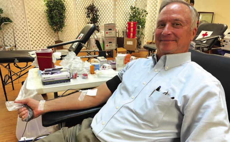 County Judge Randy Hoyer makes a donation of blood at last week’s drive. With his contribution, Hoyer has reached the one-gallon level as a donor. COURTESY PHOTO