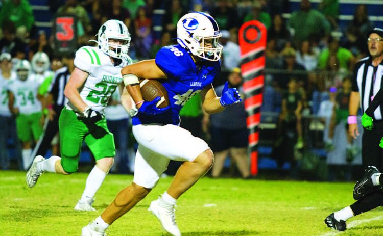 Haegan Oncken breaks toward the end zone on his second touchdown of the game last Friday. HUNTER KING | DISPATCH RECORD