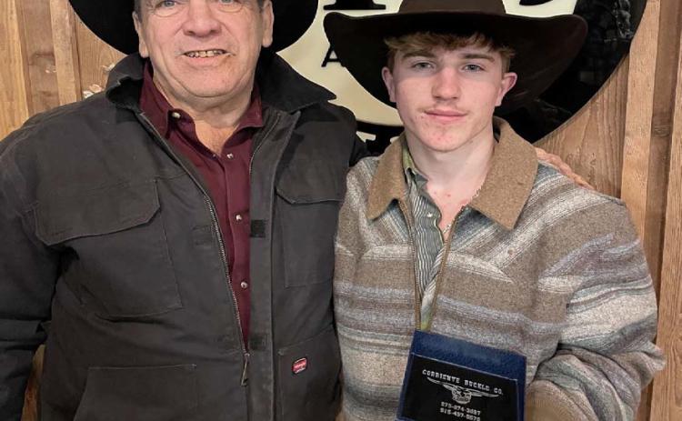 Noah Lee, right, won the 2025 Bullothon and shows off his buckle with Mike Seiler of Bullothon Promotions. COURTESY PHOTO