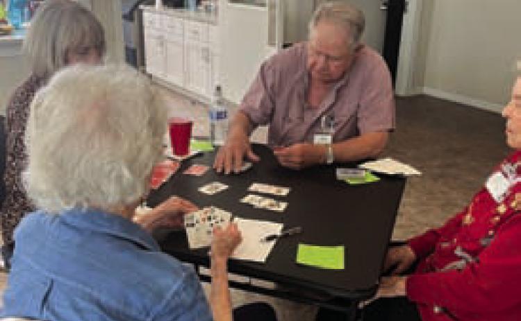 Bridge players, clockwise from bottom left, Debra Hull, Christine Vann, Tom Casbeer and Barbara Hampton were among those who gathered for Community Bridge. The next play date is May 11. COURTESY PHOT0