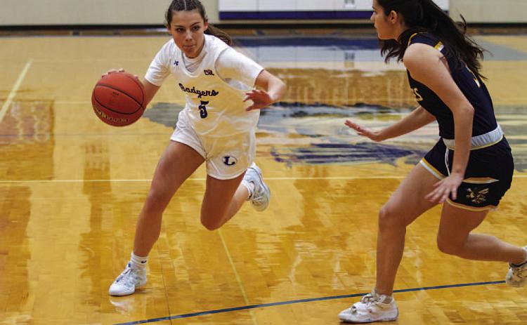 HUNTER KING | DISPATCH RECORD Chloe Thorp drives past a Stephenville defender in the first half of the Lady Badgers’ game.