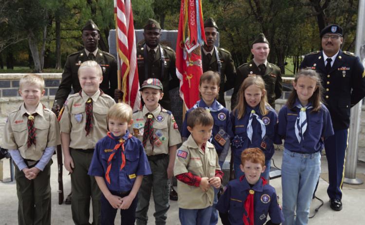 ERICK MITCHELL | DISPATCH RECORD Cub Scout Pack 100 led the audience in reciting the pledge of allegiance, while the 62nd Engineer Battalion -- the city of Kempner’s partner battalion from Fort Cavazos -- presented the colors to open the Nov. 11 Veterans Day ceremony at Sylvia Tucker Memorial Park.