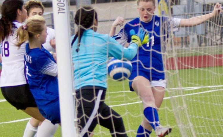 Becca Nobles (11) scores the Lady Badgers’ third goal in their season finale, a 3-0 win over Florence. JEFF LOWE | DISPATCH RECORD