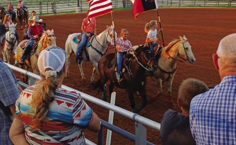 Competitors in the Lampasas Junior Rodeo circle the arena for the Grand Entry to open the evening’s activities on Friday. Lampasas Riding Club hosted the two-night event last weekend at the 580 Sports Complex rodeo arena. COURTESY PHOTO