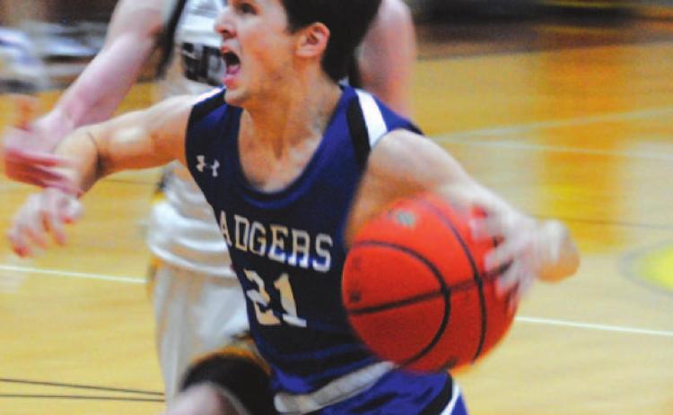 Austin Wilson drives to the basket against a Gatesville defender in last Friday’s contest. HUNTER KING | DISPATCH RECORD