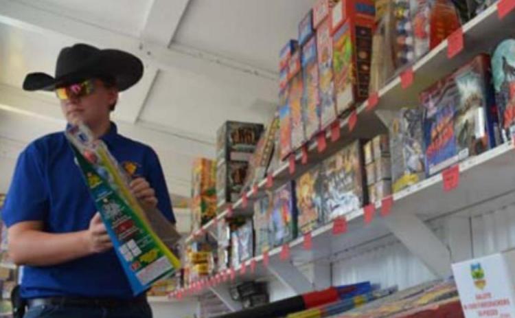 An American Fireworks employee stocks pyrotechnics before holiday sales. FILE PHOTO