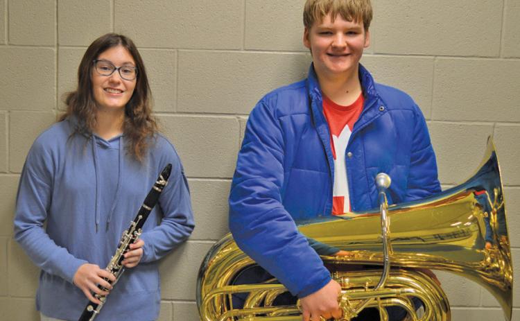 Madi Giffin and Alexander Thorne showcase their instruments. The pair are the first Badger Band members to achieve All-State honors in four years. Erick mitchell | dispatch record