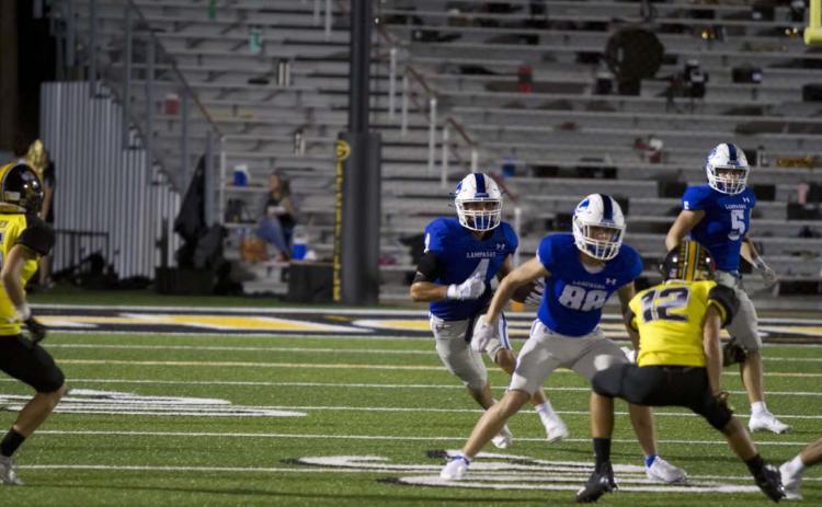 Aden Rascoe follows his blocker on a kick return during the football game against Gatesville on Sept. 24. HUNTER KING | DISPATCH RECORD