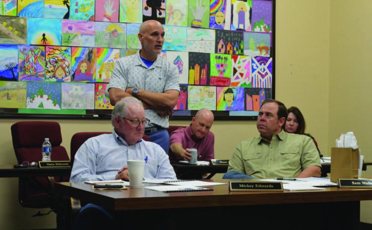 Assistant Superintendent Dana Holcomb, standing, provides highlights from the most recent Texas Academic Performance Report to Lampasas ISD trustees. Holcomb, who oversees curriculum matters for the school district, said that in 18 of 20 different STAAR tested areas, students here outperformed their counterparts across the state. ERICK MITCHELL | DISPATCH RECORD