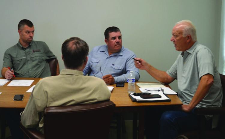 Lampasas Central Appraisal District board members, from left to right, Marshal Brewer, David Barclay, Chris Harrison and Bill Peterson discuss changes to the budget needed for 2025. ERICK MITCHELL | DISPATCH RECORD