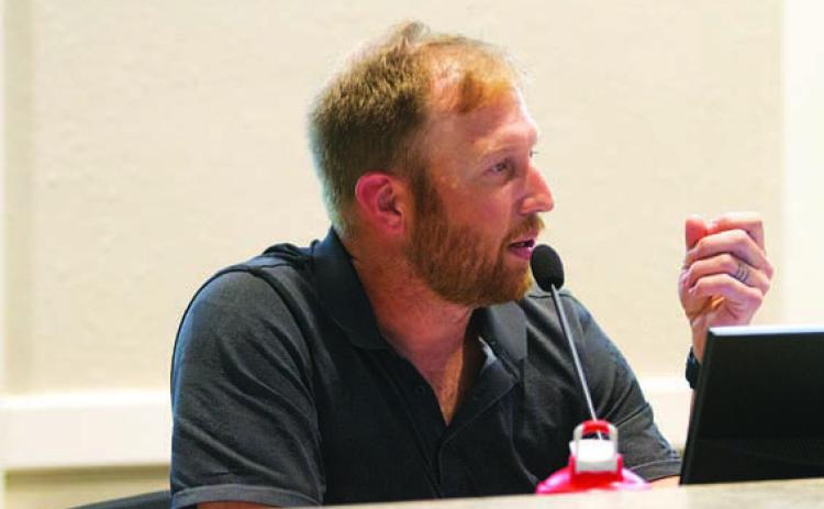 Councilman Edward Gold voices his opposition to a smoke shop planned near the high school campus, but he changed his vote after Interim City Manager Erin Harrison said there were no legal grounds to oppose the special-use permit sought for it. HUNTER KING | DISPATCH RECORD