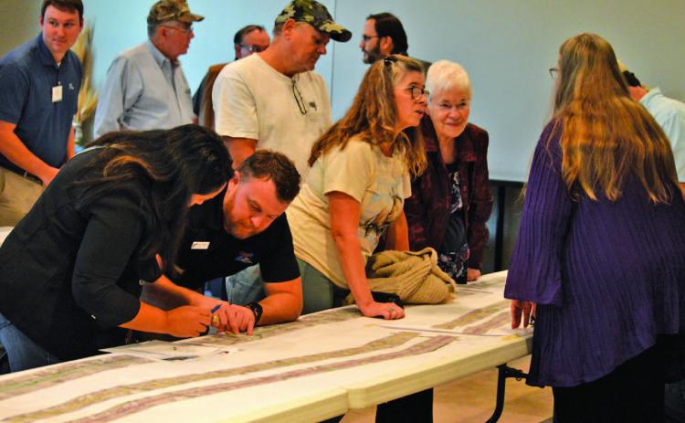 Lampasas County residents chat with TxDOT officials during Tuesday night’s open house to discuss plans for the expansion of U.S. Highway 281 from Lampasas to Evant. ERICK MITCHELL | DISPATCH RECORD
