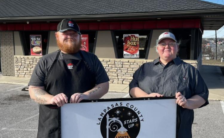 Lampasas Pizza Hut associates accepting the Night Sky Friendly award are Joseph White and manager April Ayers. COURTESY PHOTO