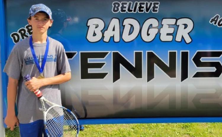 Tyler Ecker is shown with his gold medal from the eighth-grade boys’ singles championship. COURTESY PHOTO