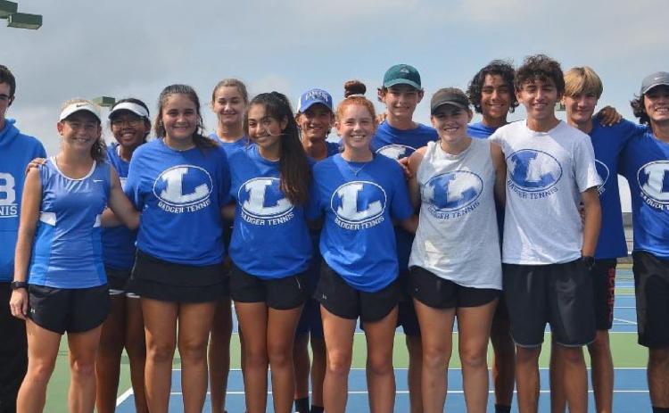 COURTESY PHOTO The Badger tennis squad poses for a photo after their win over Decatur in the bi-district playoff round on Tuesday.