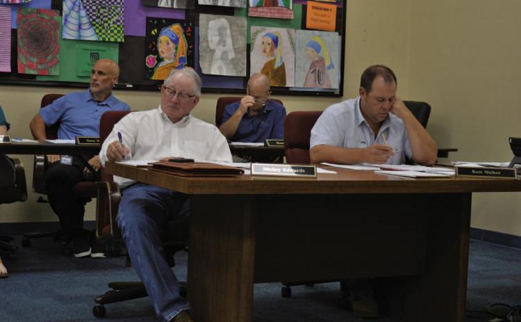 ERICK MITCHELL | DISPATCH RECORD LISD board members Mickey Edwards and Sam Walker look on during Wednesday’s called meeting.
