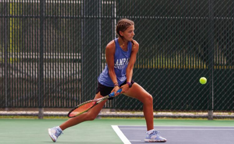 ANA SOFIA MEYER | DISPATCH RECORD Madelynn White volleys back against her Wimberley opponent. White’s match went to a third set tie break but was suspended before it could finish.