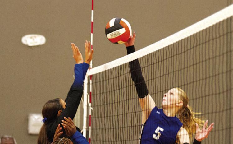 HUNTER KING | DISPATCH RECORD Mattie McBeth rises up for a kill against the Copperas Cove junior varsity team last Friday.