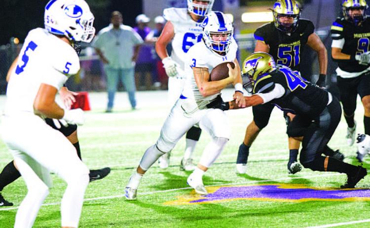 Reed Jerome runs through an attempted tackle against Marble Falls last Friday night. HUNTER KING | DISPATCH RECORD