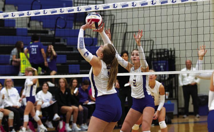 Ava Dowdy sets for a kill during the match against Lago Vista. HUNTER KING | DISPATCH RECORD