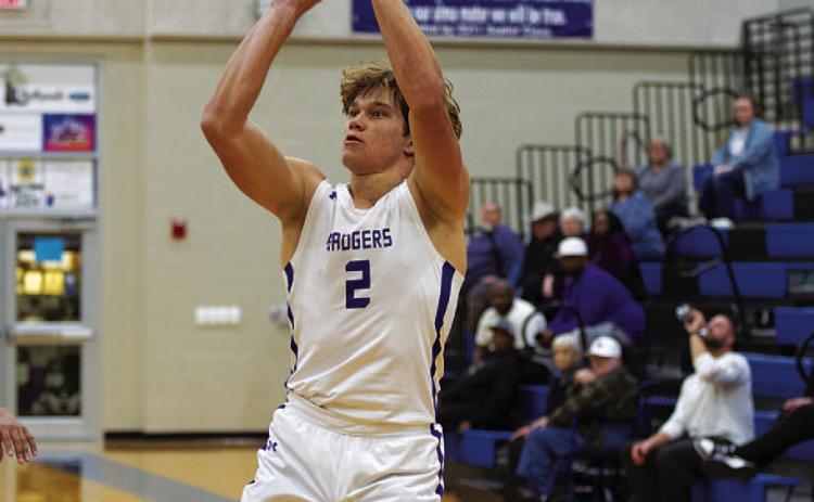 Haegan Oncken releases a three-point shot on his way to 16 points against Taylor. HUNTER KING | DISPATCH RECORD